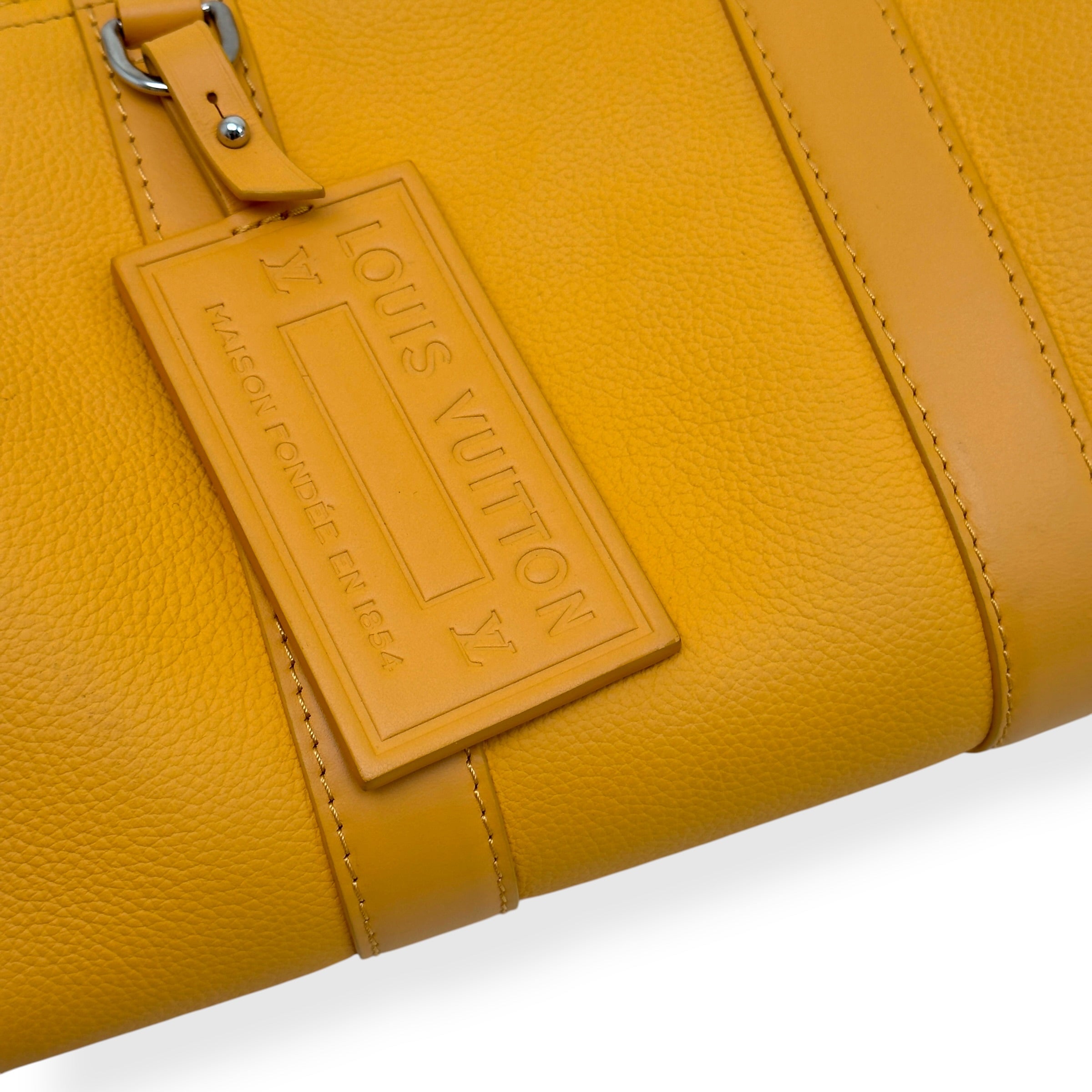 LOUIS VUITTON CITY KEEPALL AEROGRAM CROSSBODY BAG MUSTARD