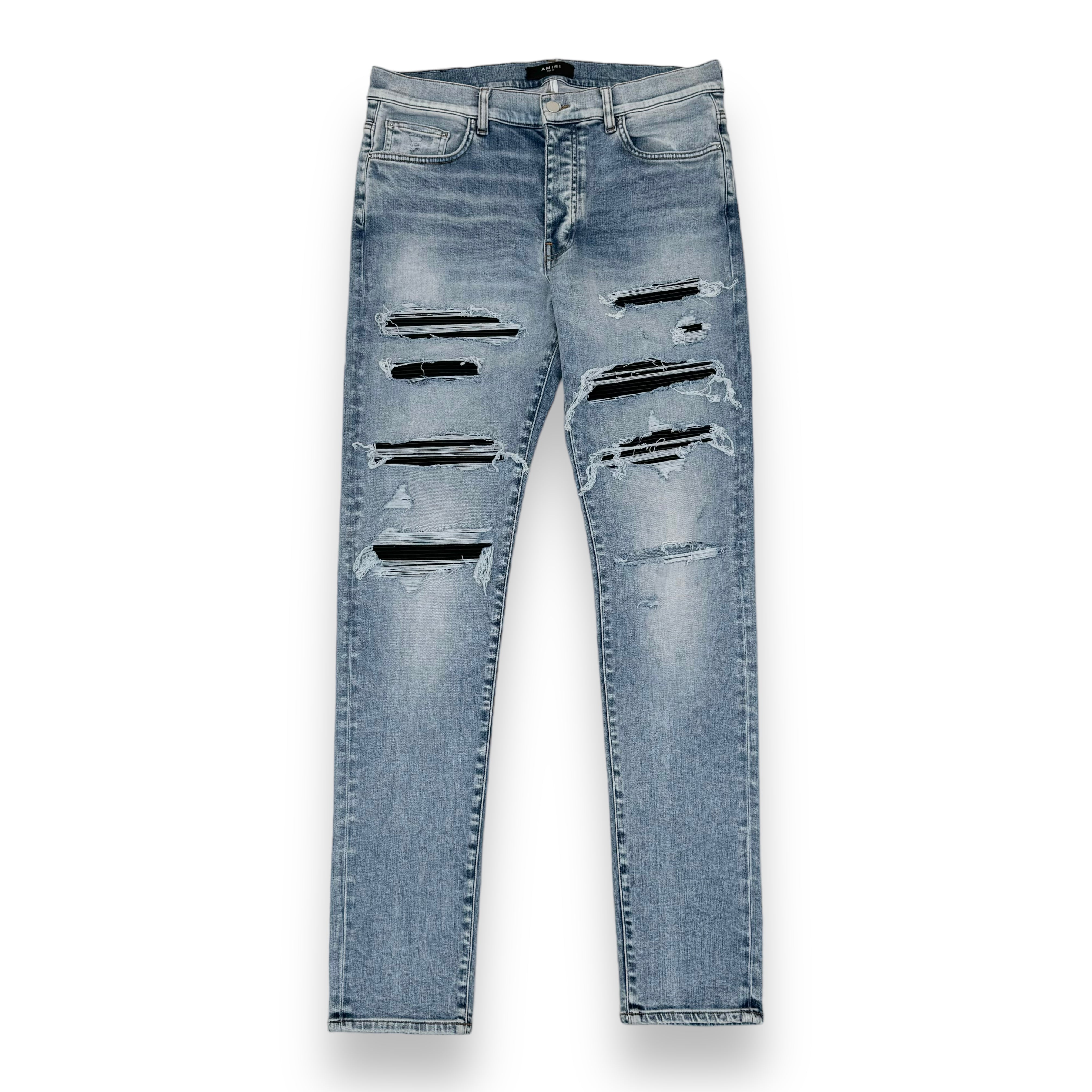 AMIRI DISTRESSED LEATHER PATCH WASHED DENIM JEANS BLUE 36W