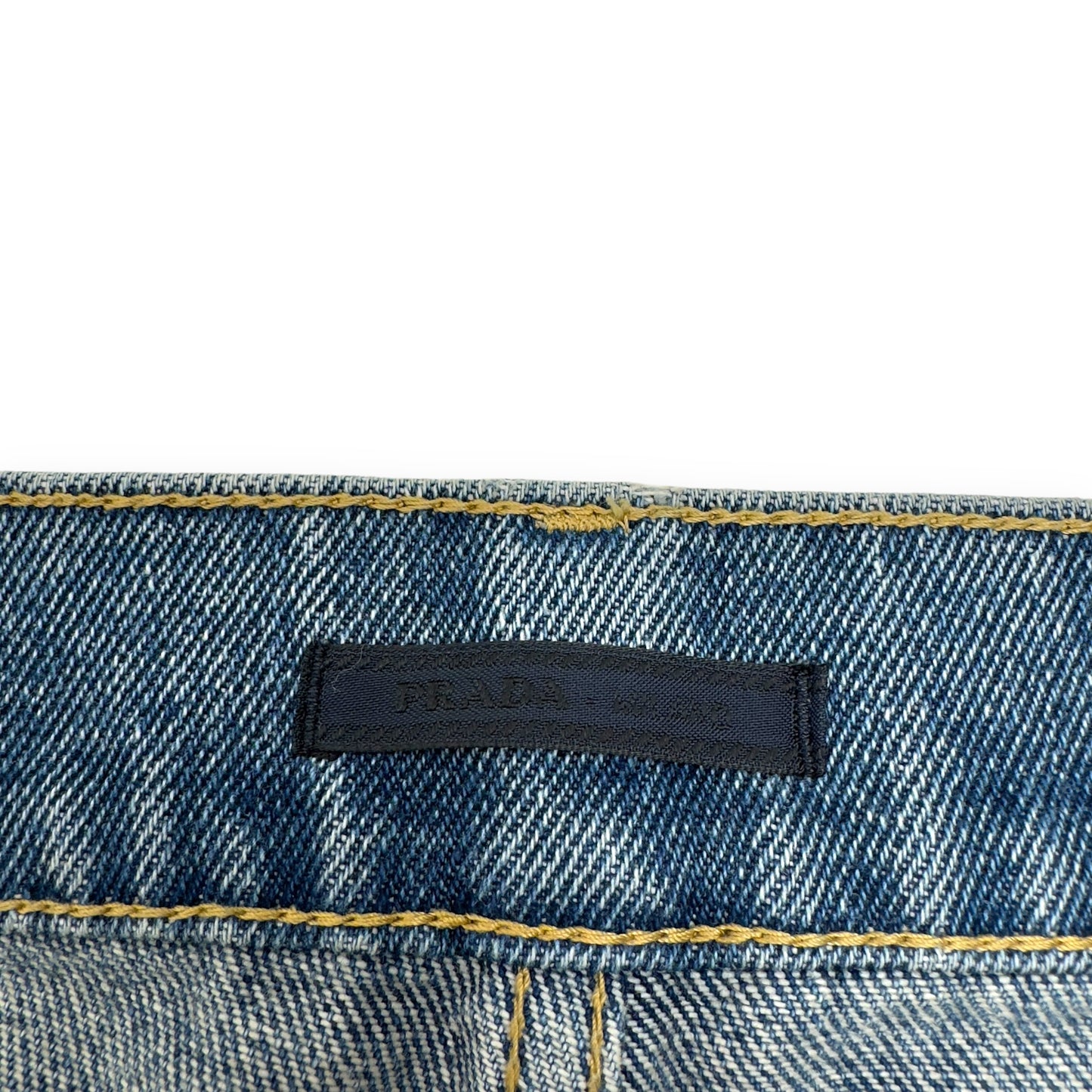 PRADA TRAINGLE-LOGO PLAQUE DISTRESSED DENIM JEANS BLUE W32”