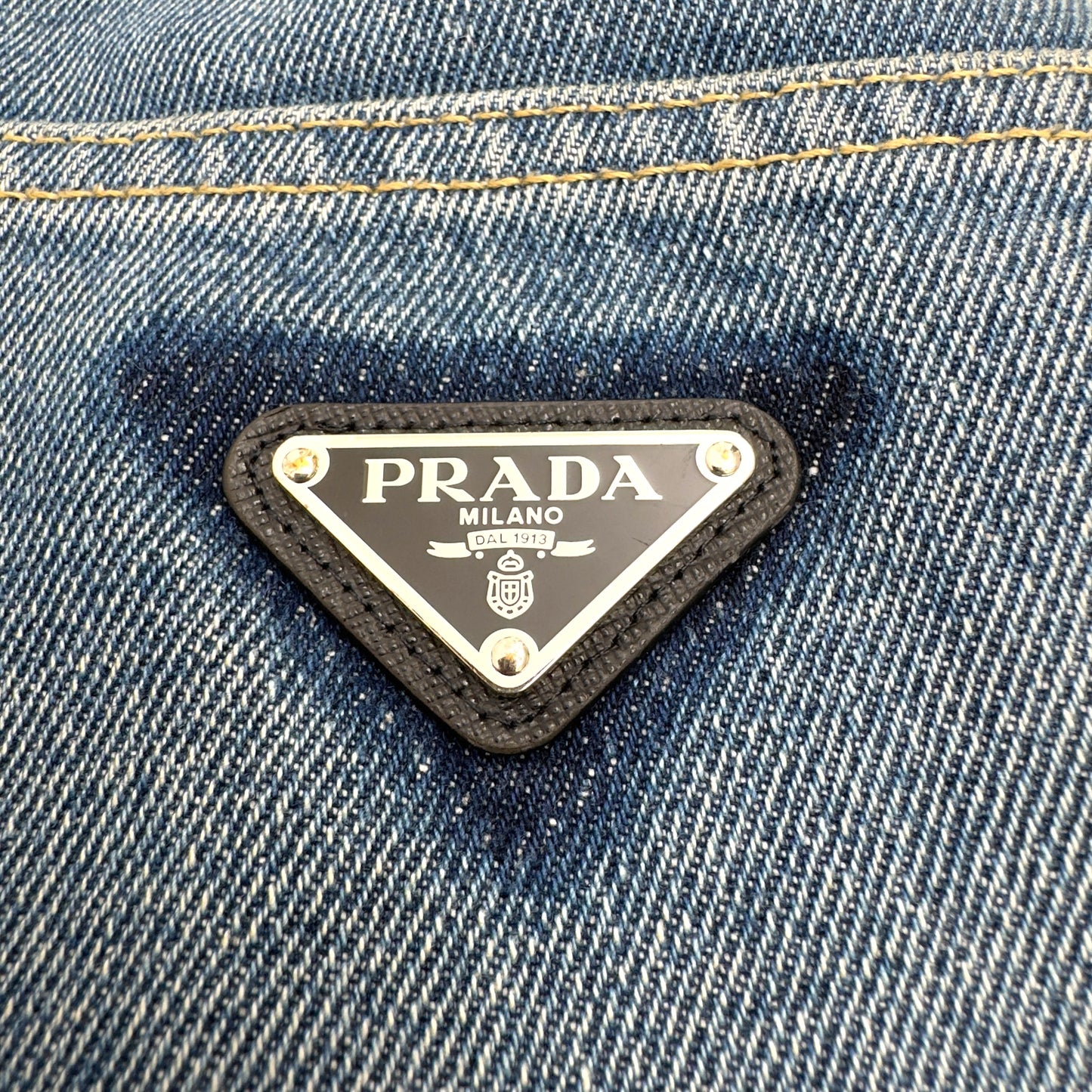PRADA TRAINGLE-LOGO PLAQUE DISTRESSED DENIM JEANS BLUE W32”