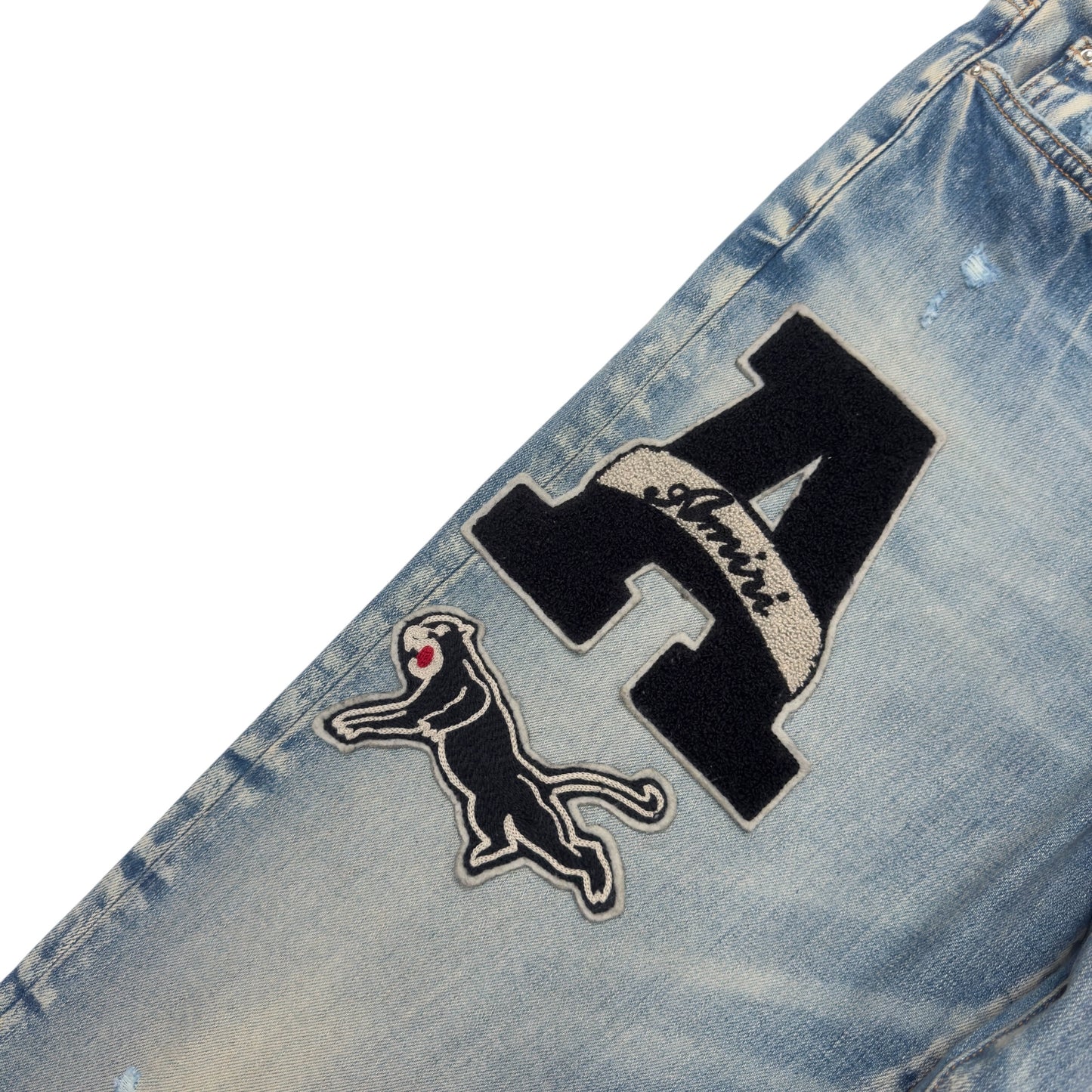 AMIRI VARSITY PATCH DISTRESSED SKINNY DENIM JEANS BLUE / BLACK W34”