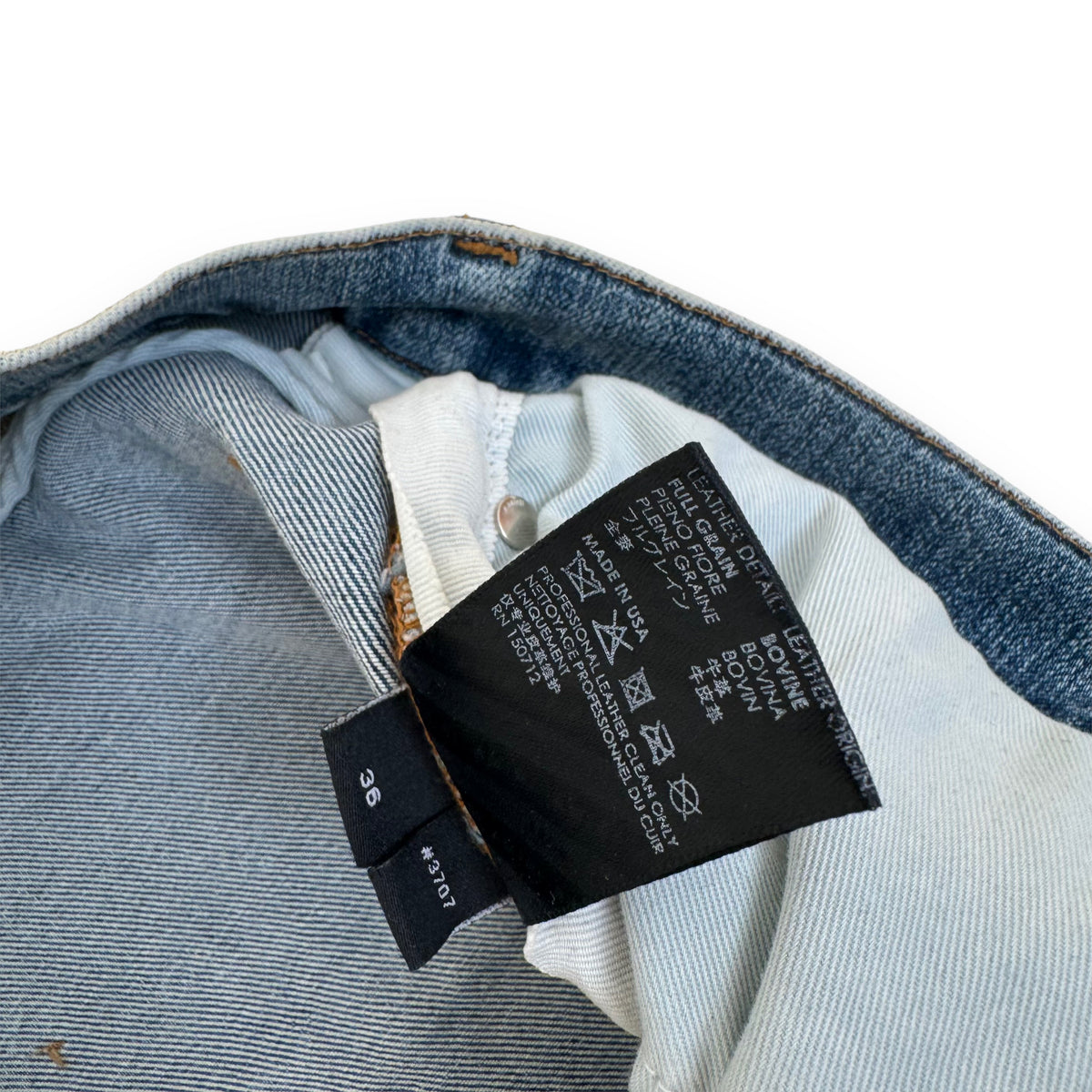 AMIRI DISTRESSED LEATHER PATCH WASHED DENIM JEANS BLUE 36W