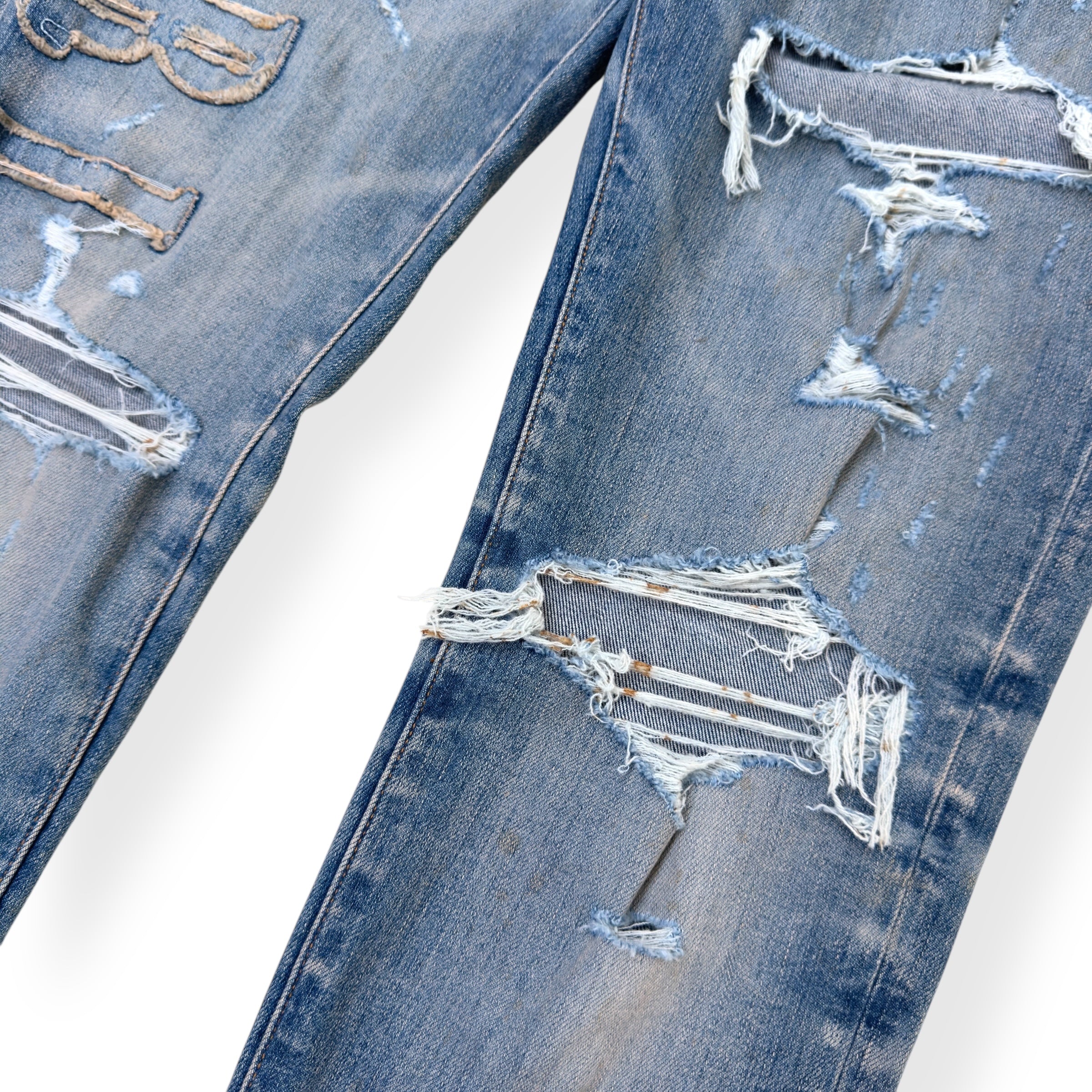 AMIRI LOGO APPLIQUE SKINNY DENIM JEANS INDIGO W34”