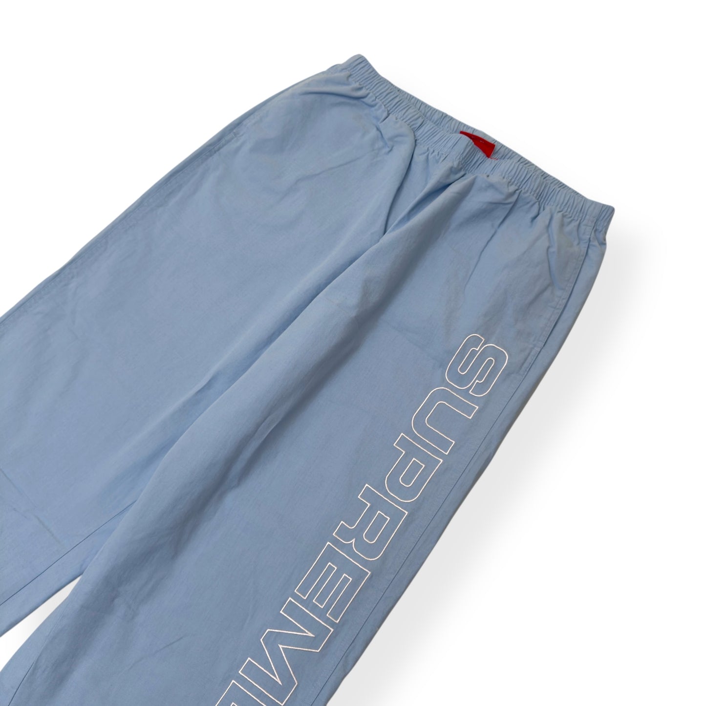 SUPREME SPELLOUT EMBROIDERED TRACK PANTS BABY BLUE XL
