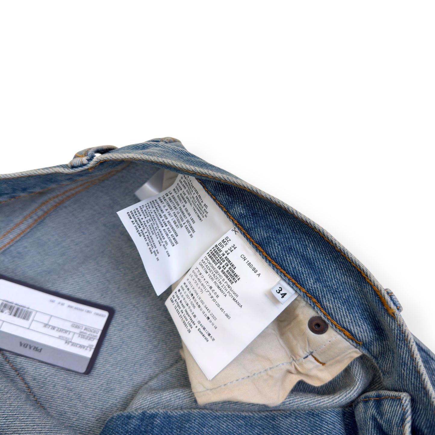 PRADA PLAQUE-LOGO WASHED DENIM JEANS BLUE W34”