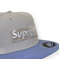 SUPREME CHAMPIONSHIP BOX LOGO NEW ERA FLAT CAP GREY / PURPLE