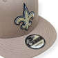 NEW ERA NEW ORLEANS SAINTS 9FIFTY FLAT CAP GREY / GOLD