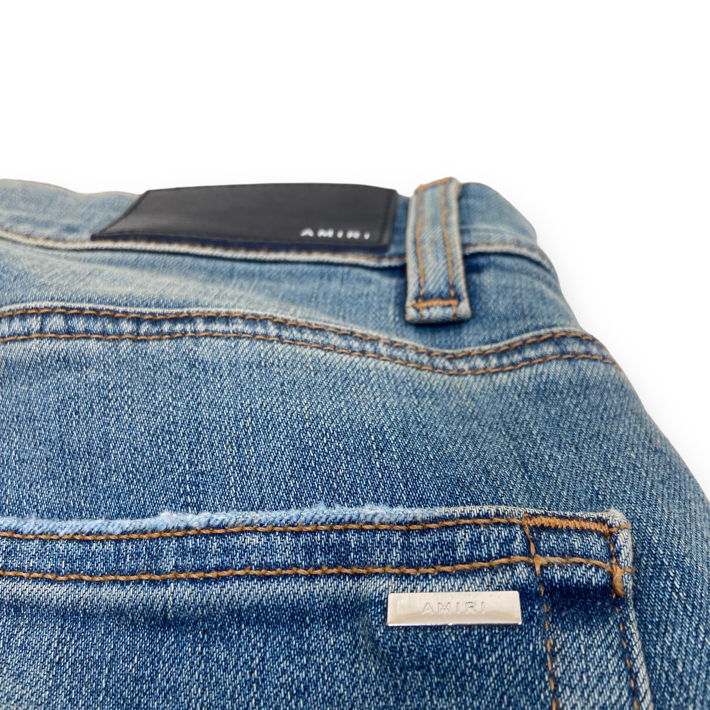 AMIRI DISTRESSED LEATHER PATCH DENIM JEANS BLUE 31W