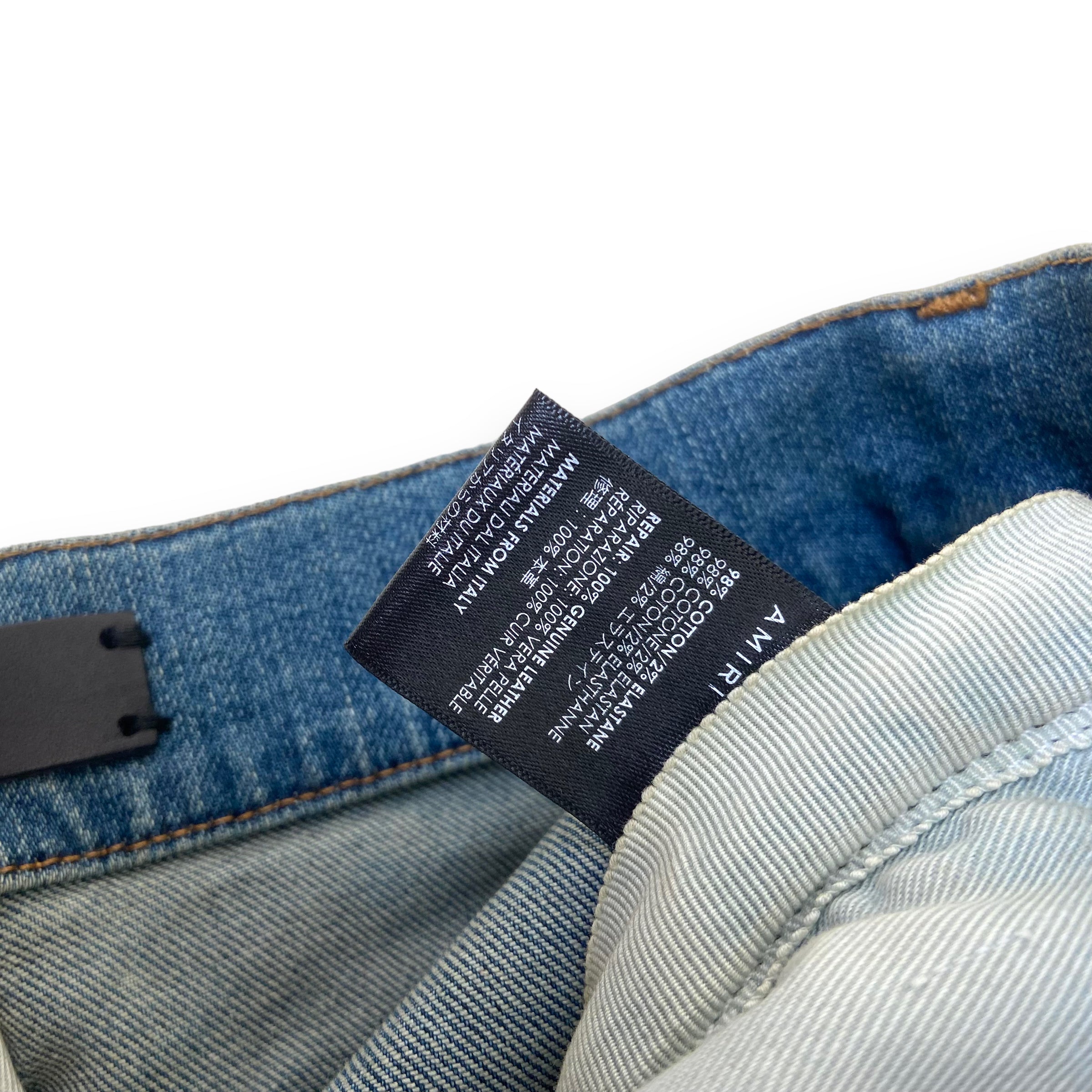 AMIRI DISTRESSED LEATHER PATCH DENIM JEANS BLUE 31W